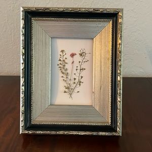 Dried pressed framed floral wall art I hues of pink and brown.
